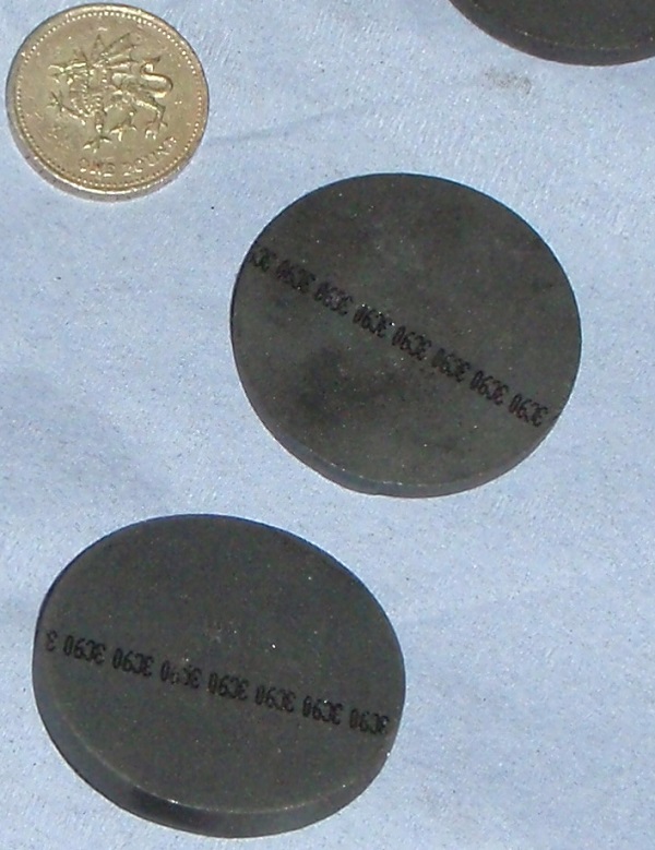 Ferrite discs cut from square ferrite plates
