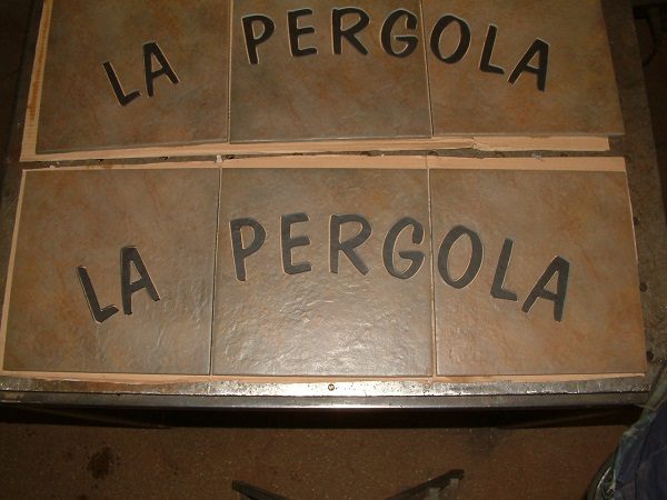 la pergola entrance logo floor tiles